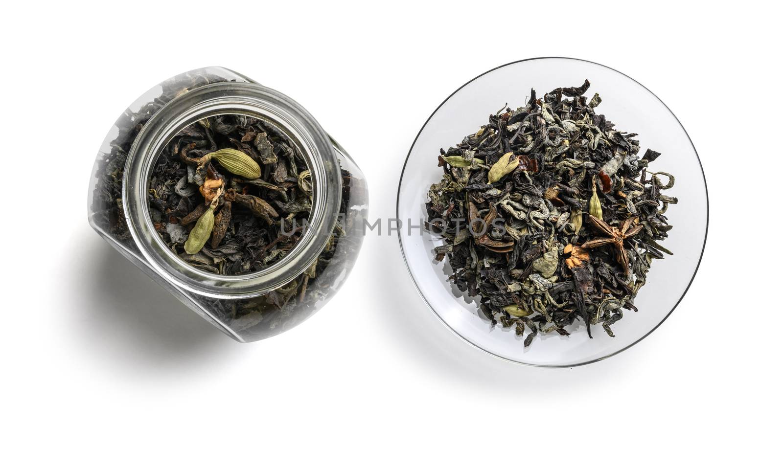 Green tea with aromatic additives. Top view on white background.