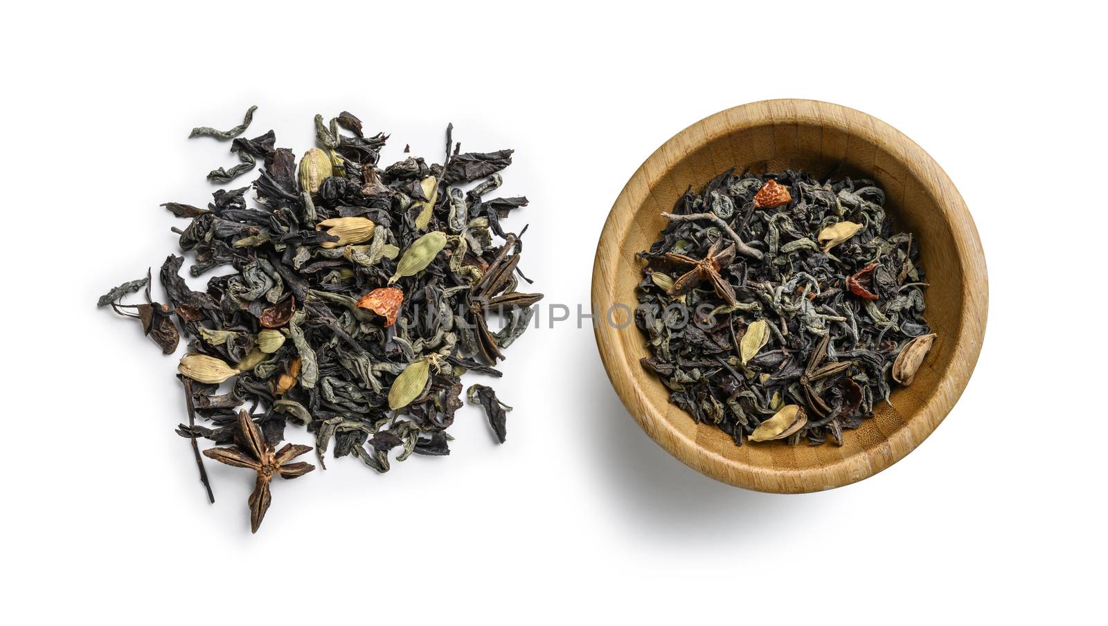 Green tea with aromatic additives. Top view on white background.