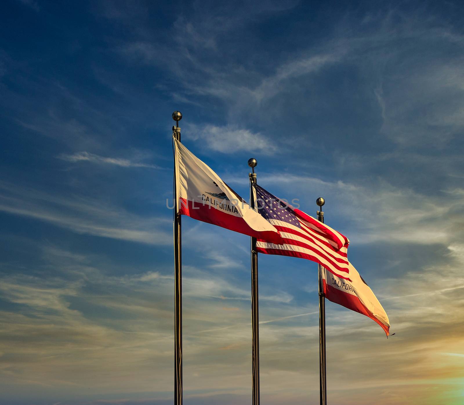 California and American Flags at Sunset on Nice Sky