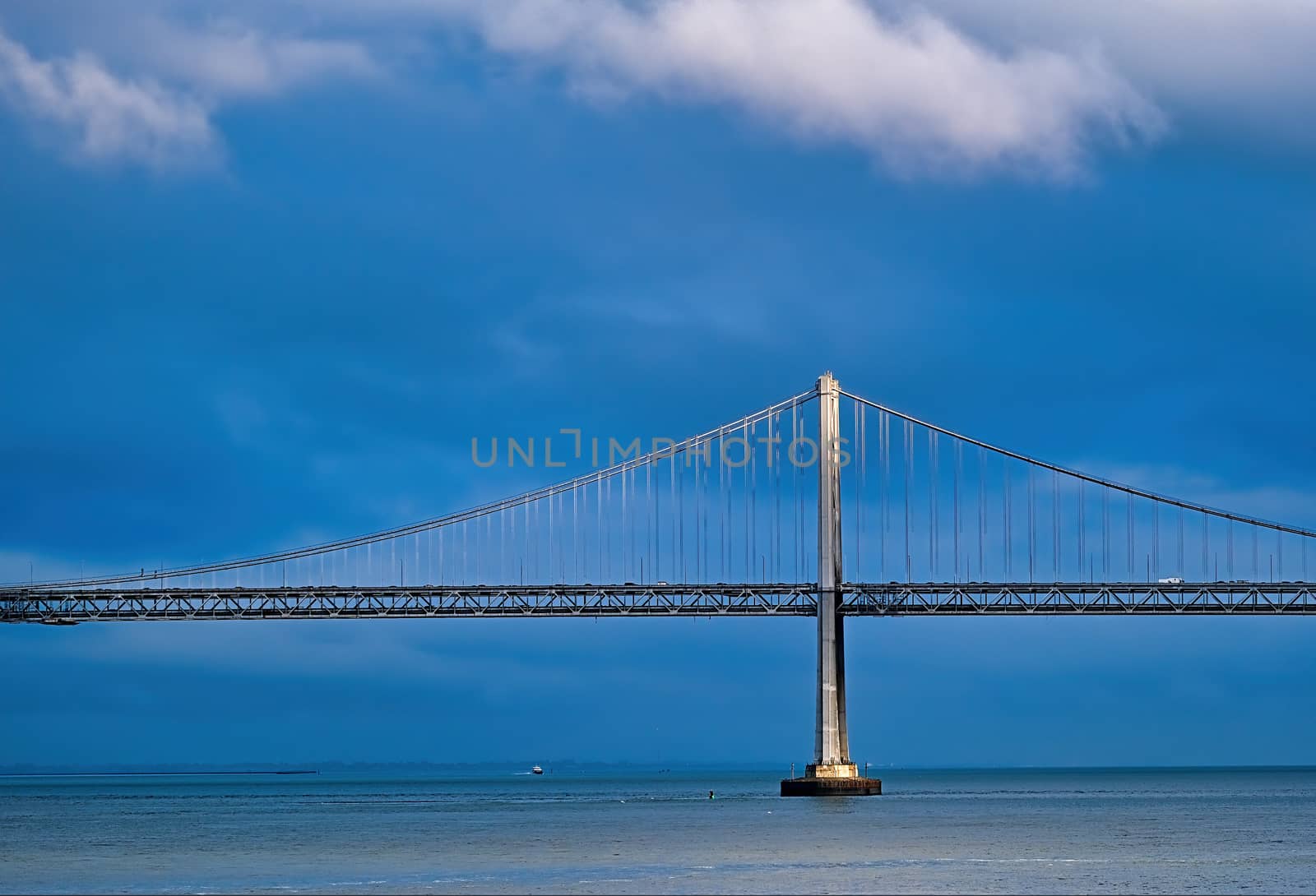 Sunlight on Bay Bridge Through Storm Clouds