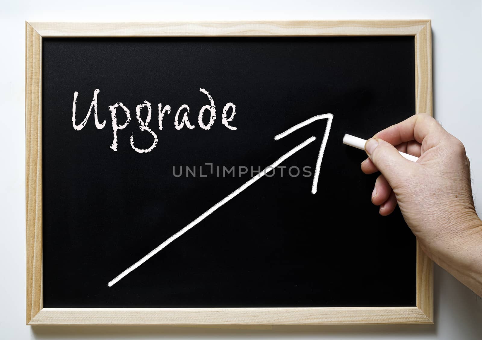 the word upgrade on a blackboard by sergiodv