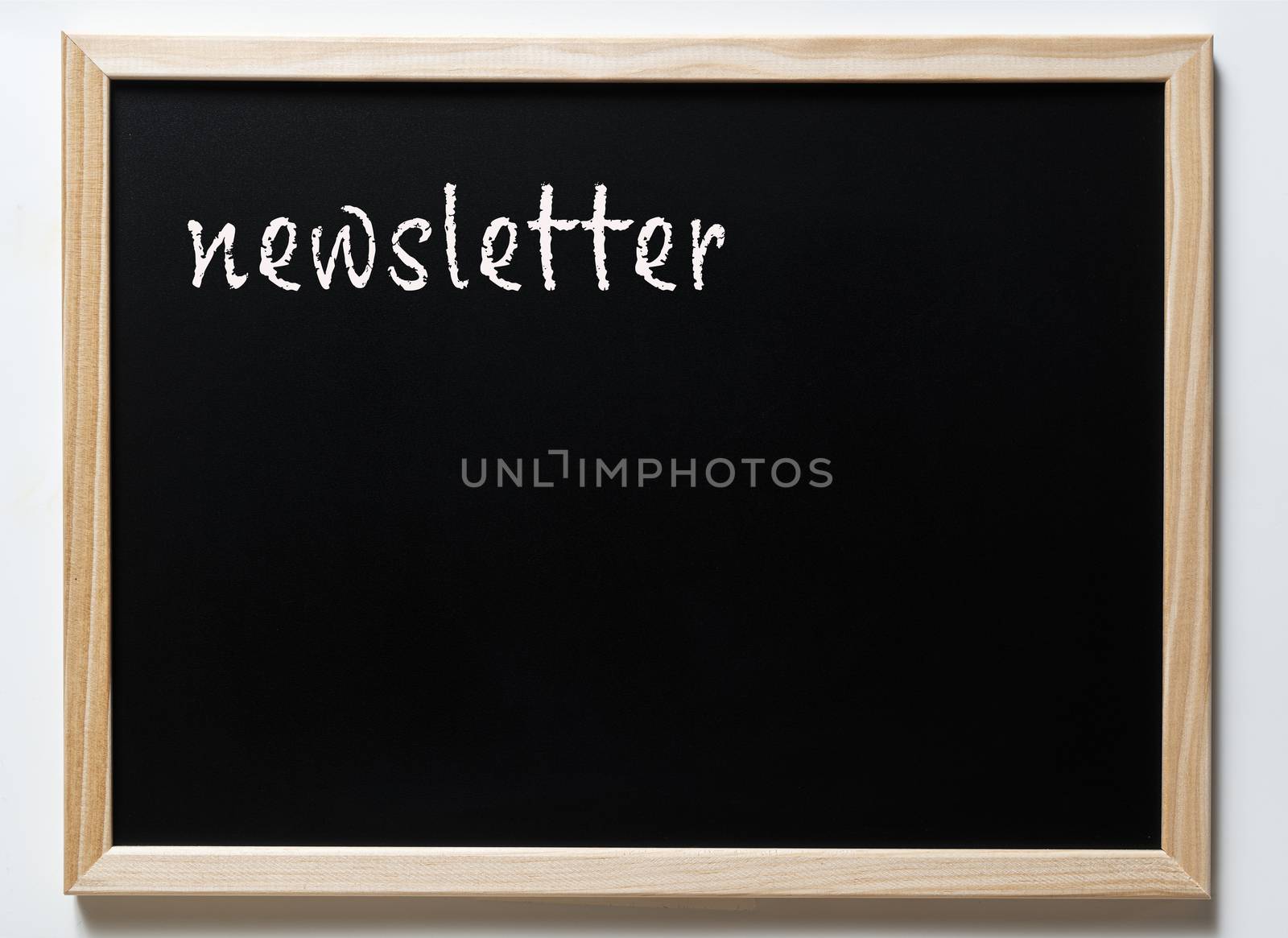 a blackboard with written newsletter