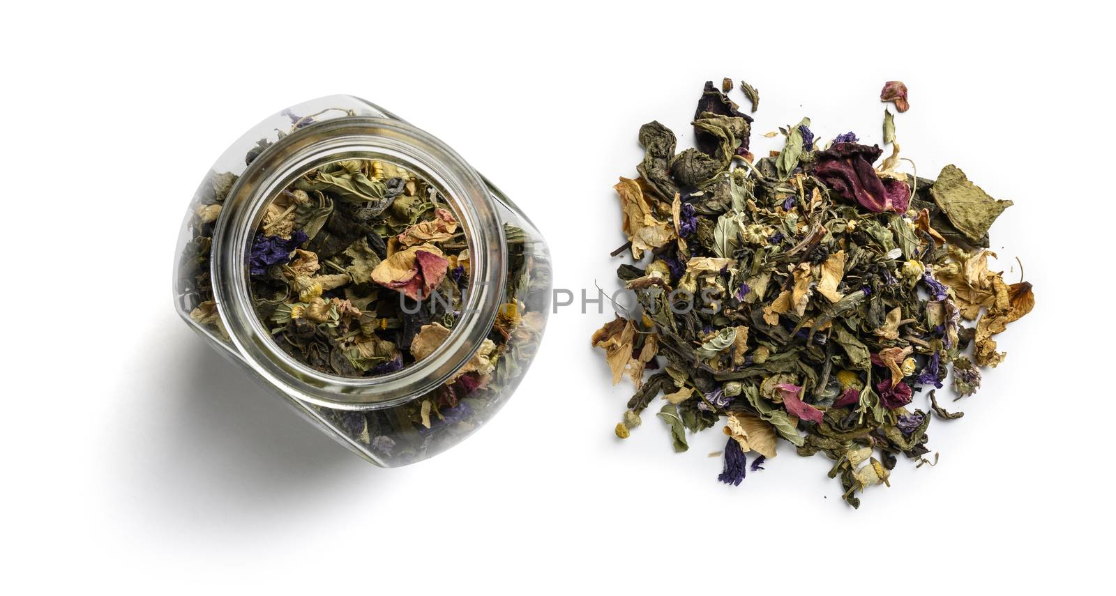 Green tea with natural aromatic additives. Top view on white background.