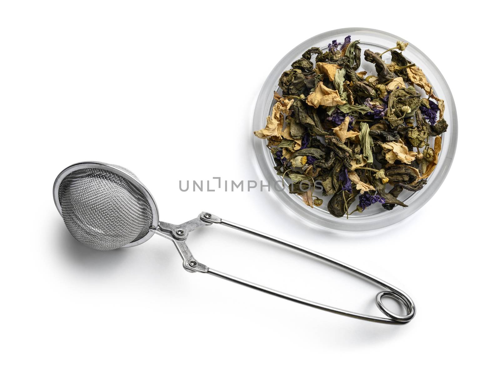 Green tea with natural aromatic additives. Top view on white background.