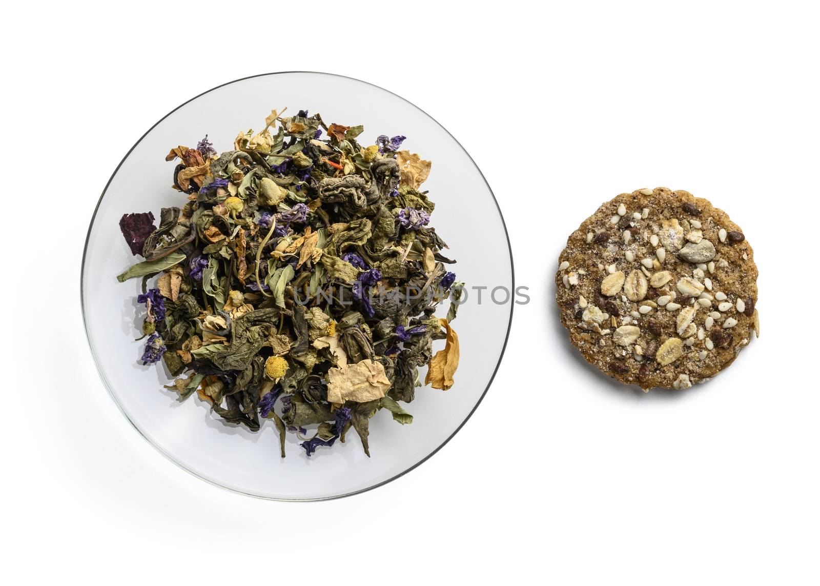 Green tea with natural aromatic additives. Top view on white background.