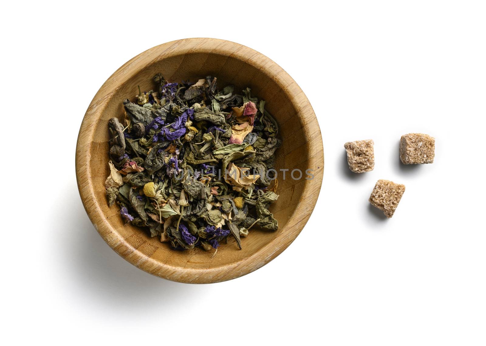 Green tea with natural aromatic additives. Top view on white background.