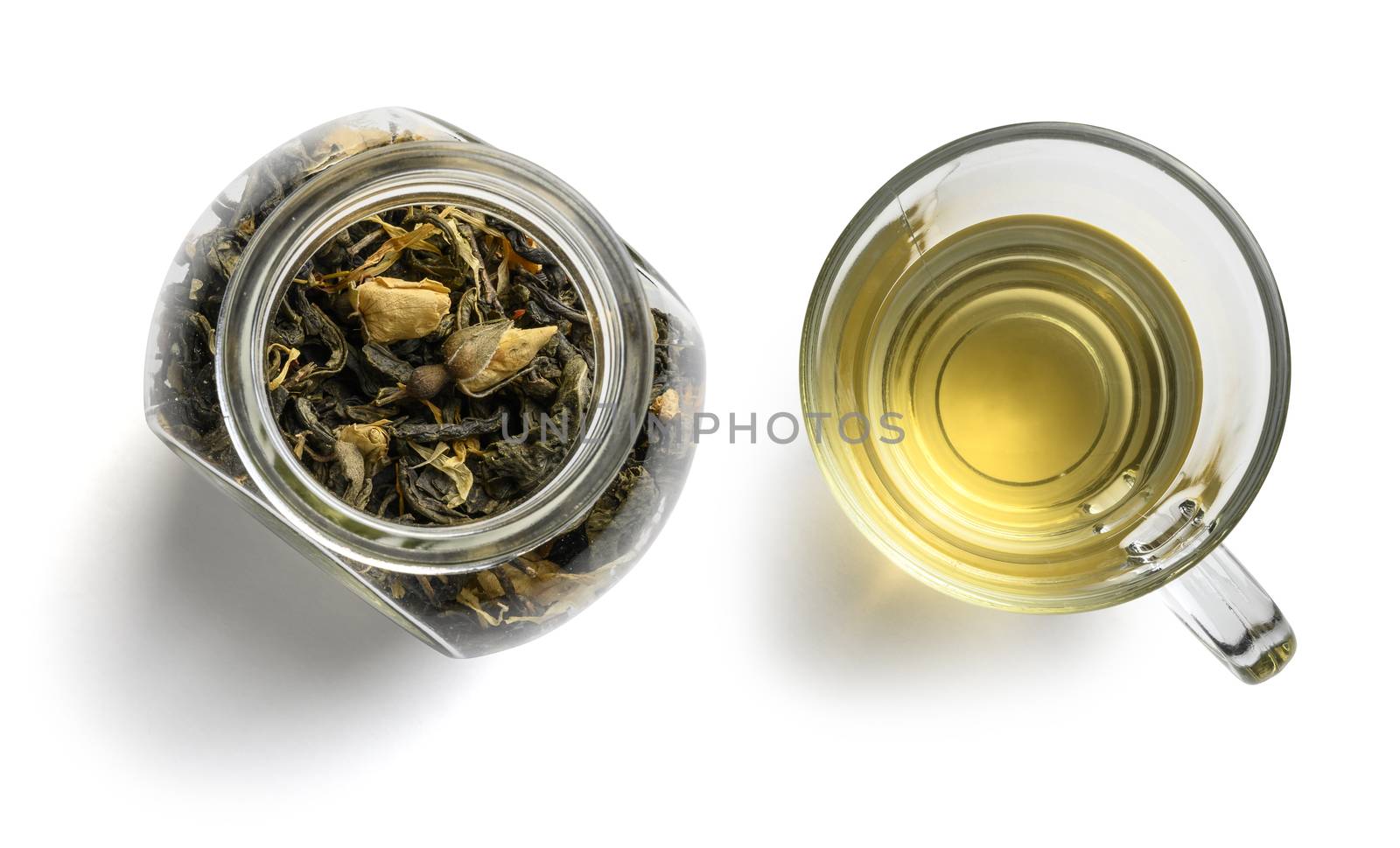 Green tea with natural aromatic additives. Top view on white background.