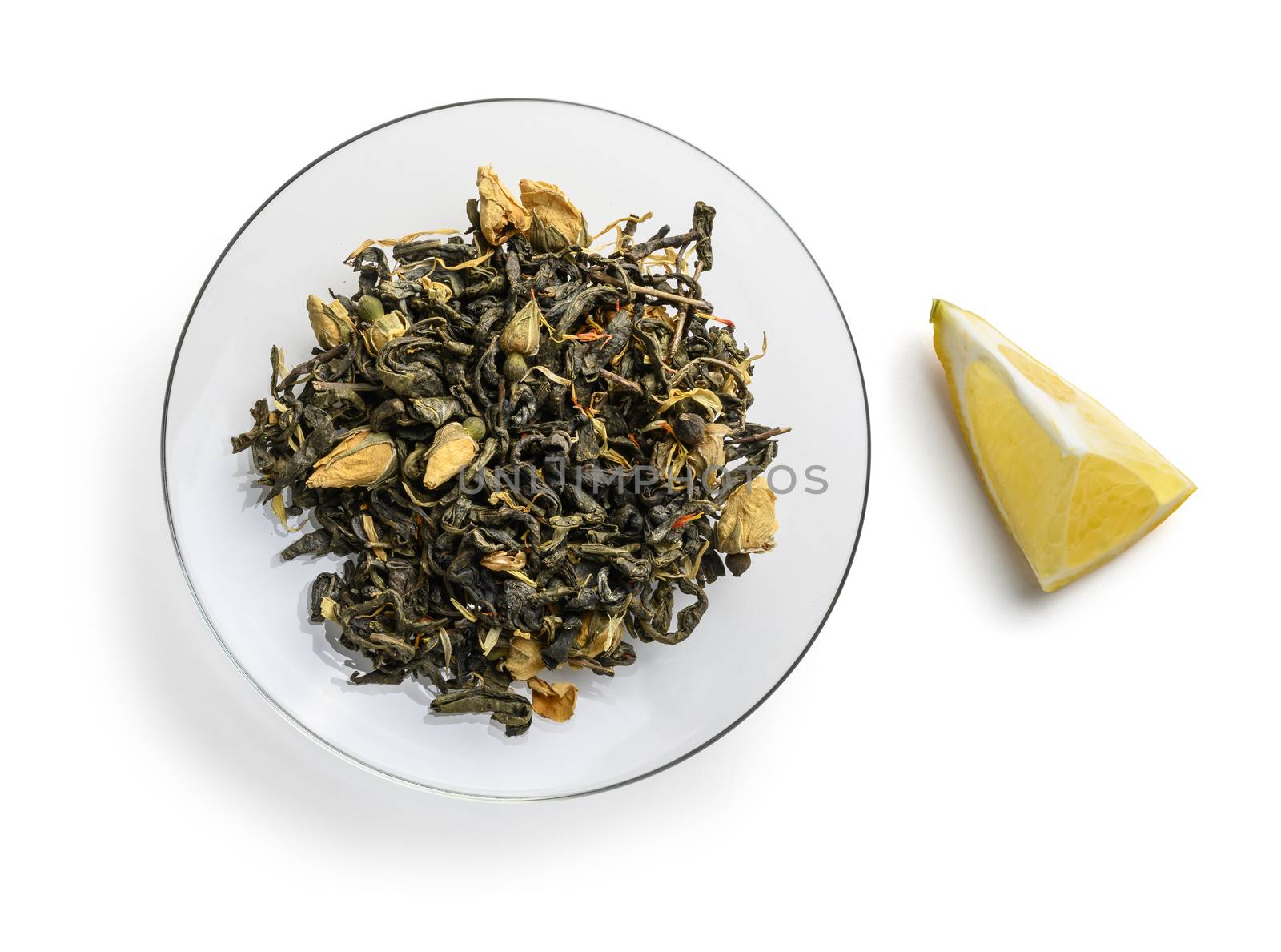Green tea with natural aromatic additives. Top view on white background.