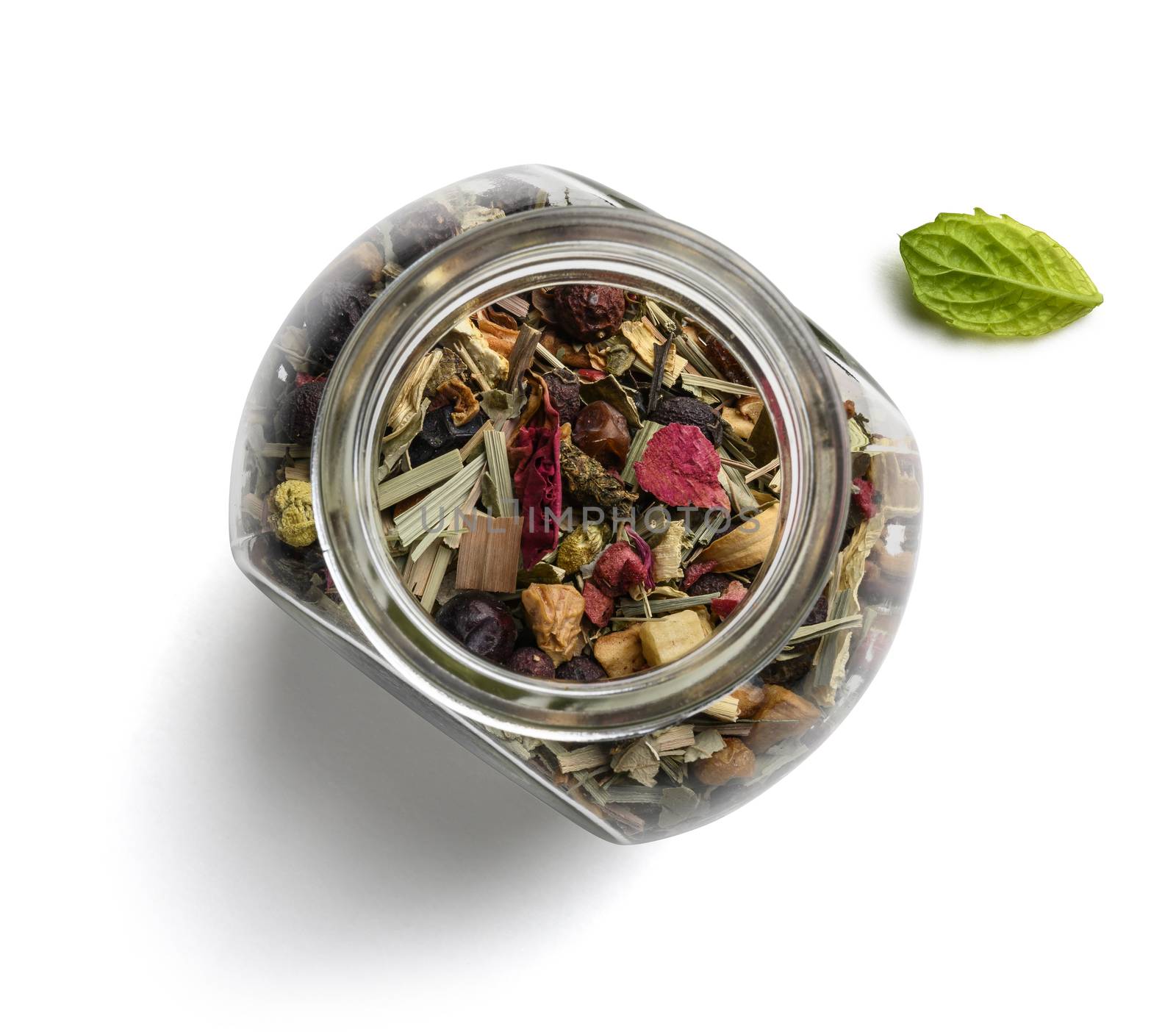 Green tea with natural aromatic additives. Top view on white background.