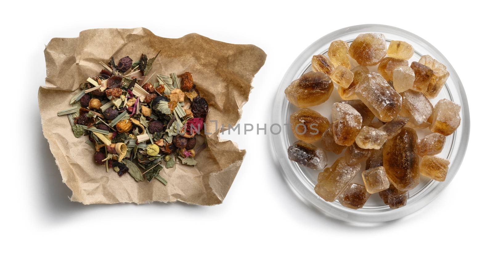 Green tea with natural aromatic additives and caramel sugar. Top view on white background.