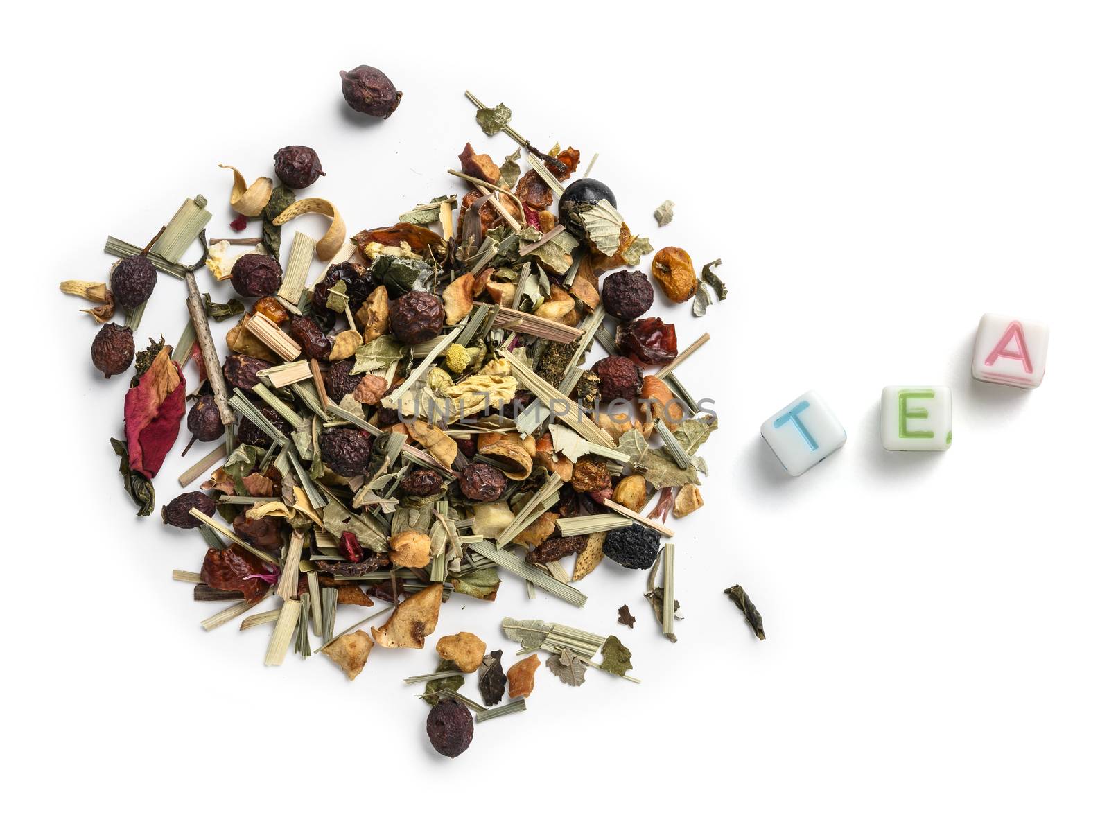 Green tea with natural aromatic additives. Top view on white background.