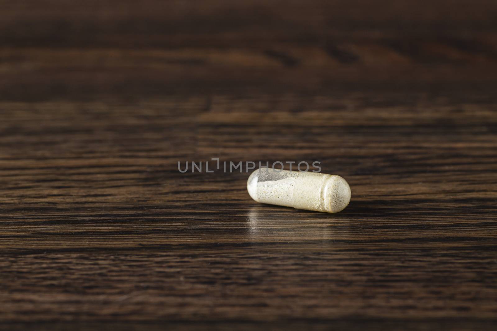 Pill filled with white powder by mypstudio