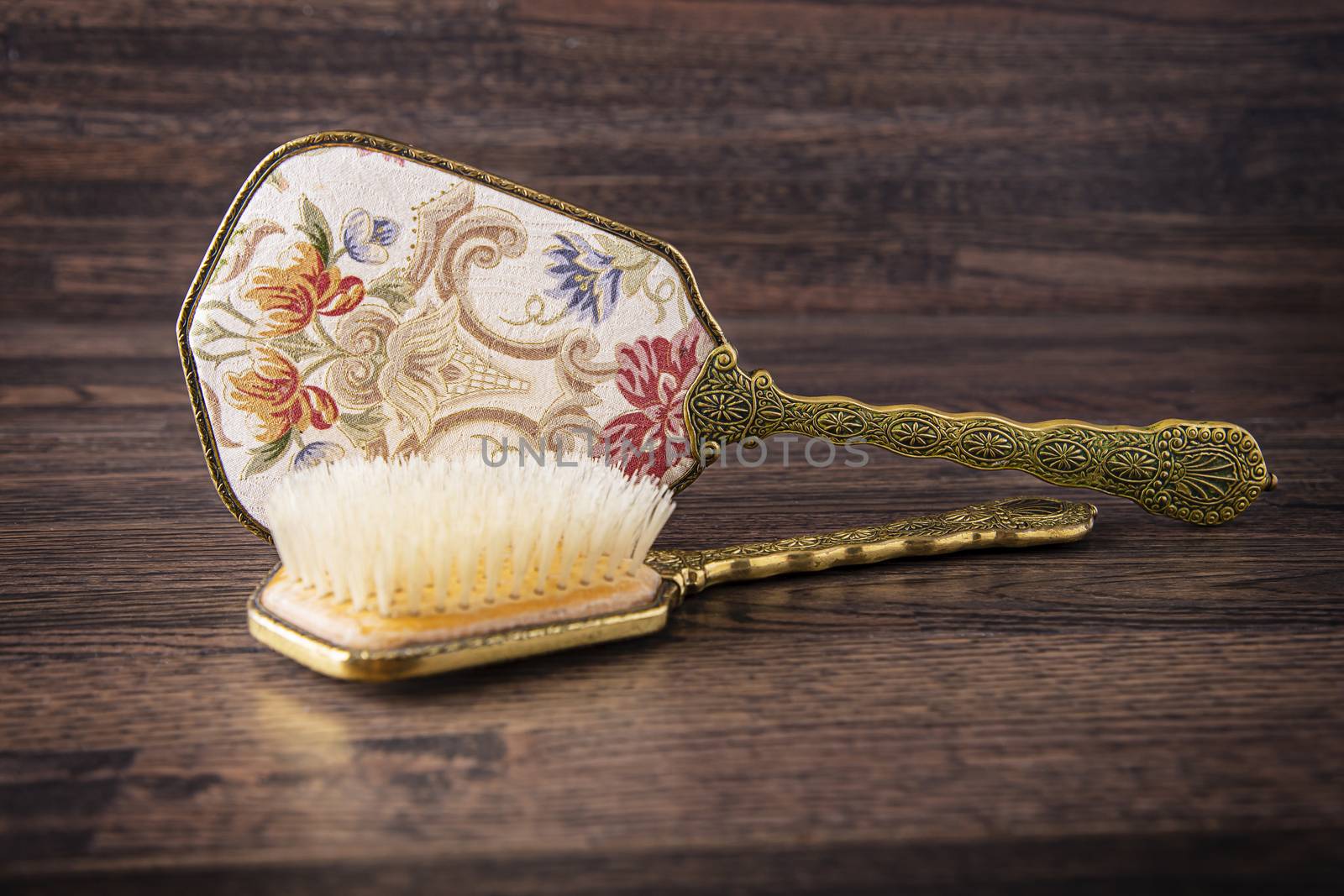 antique hair brush with decorative hand mirror