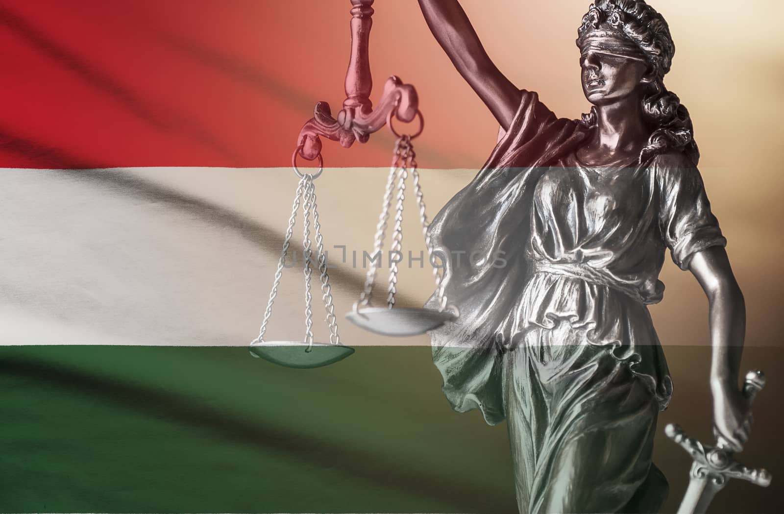 Figure of Justice superimposed on the national flag of Hungary conceptual of law and impartiality