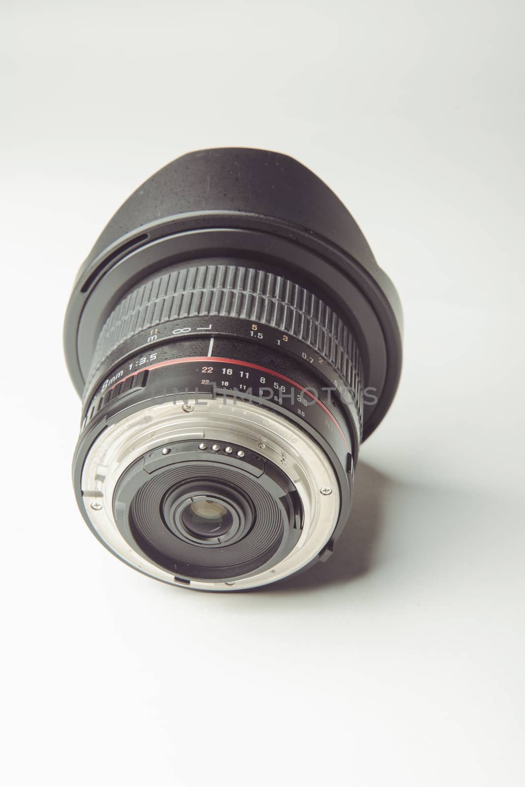 close up of a camera photo lens on white