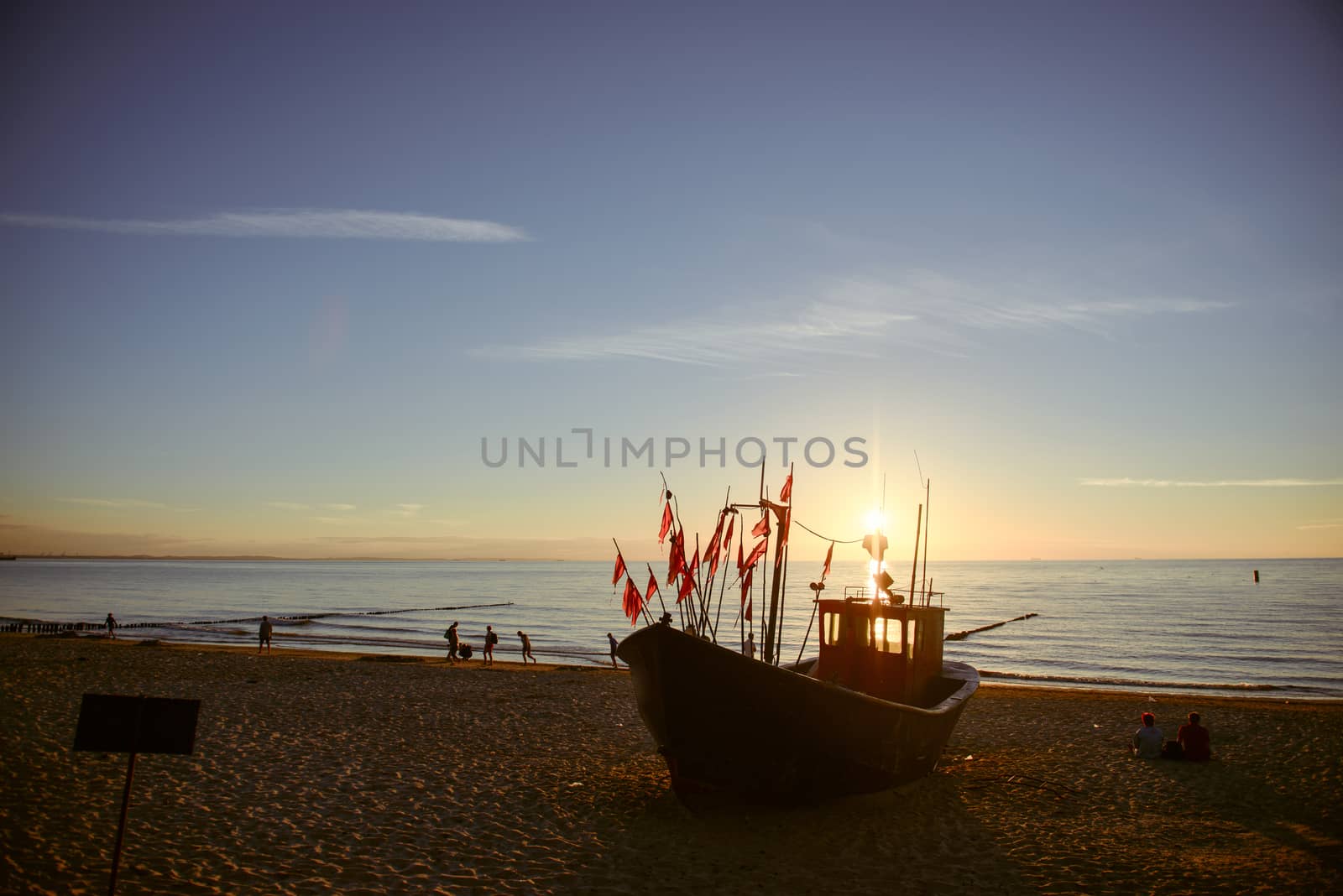 fisherman boats at sunrise time on the beach in summer