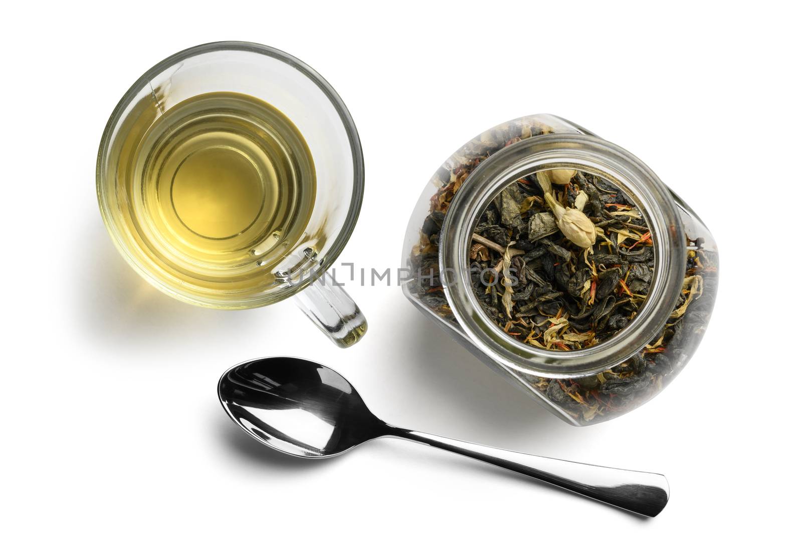 Green tea with natural aromatic additives and a Cup of tea. Top view on white background.