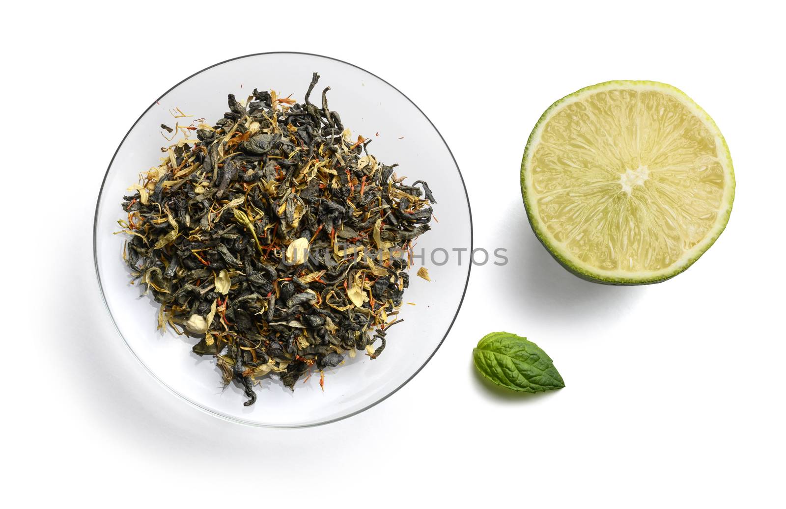 Green tea with natural aromatic additives. Top view on white background.