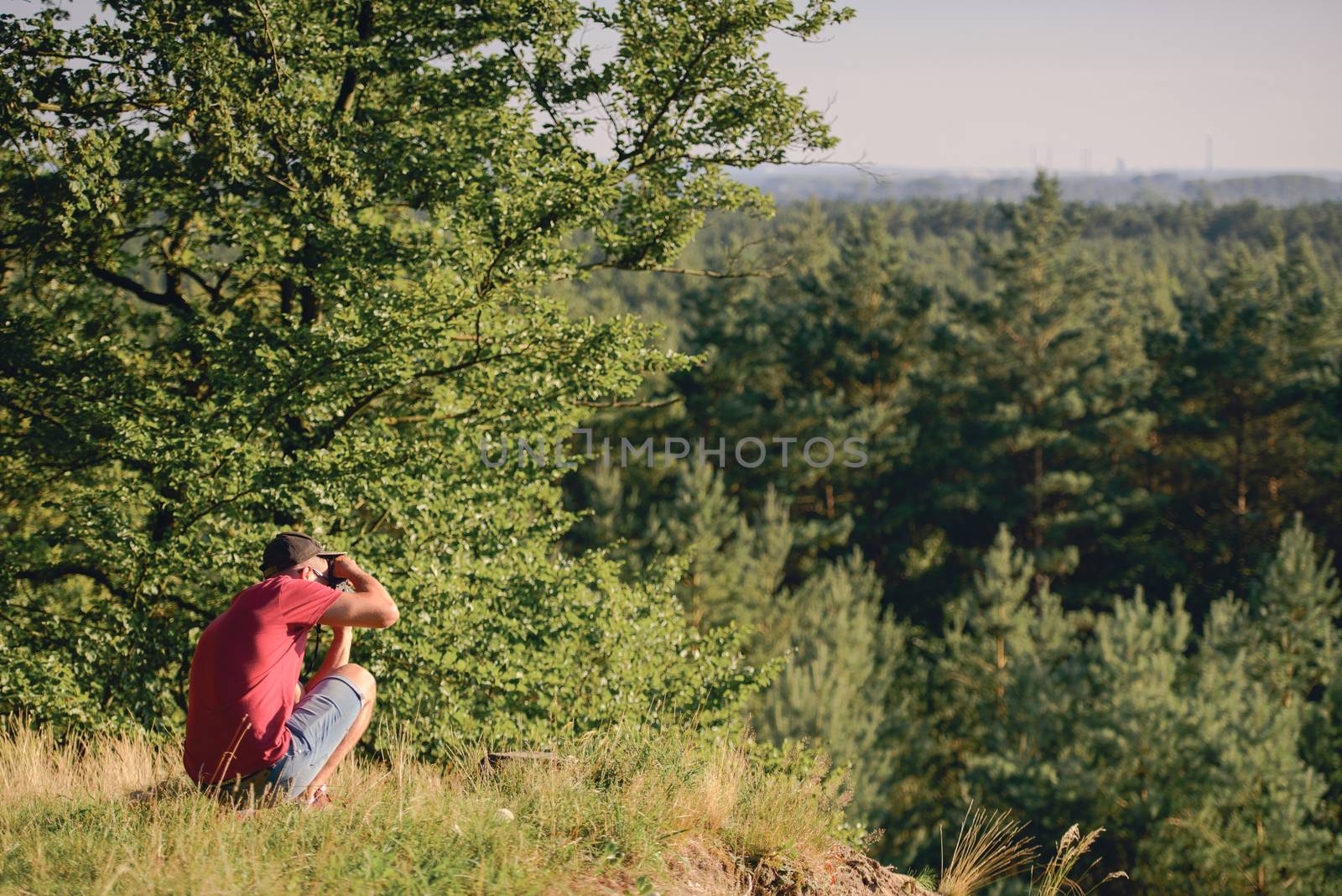 Photographer's boyfriend takes a photo. Summer season. Nature and landscape photography