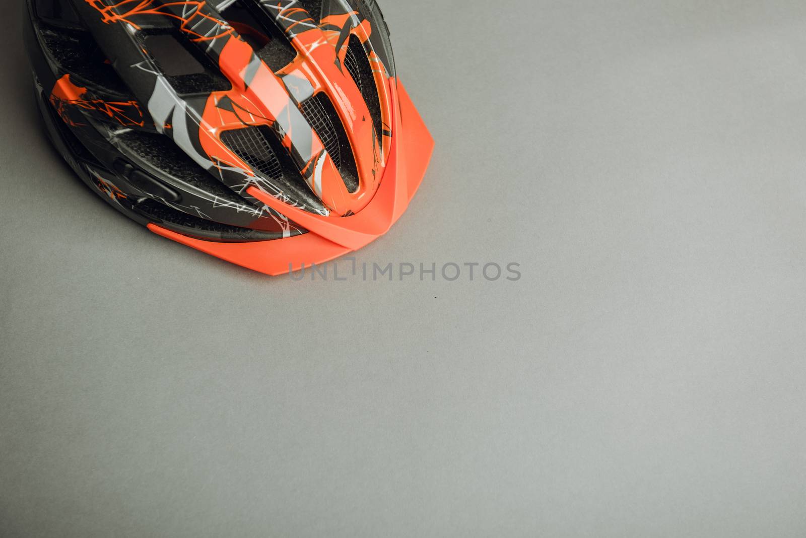 Helmet, gloves, shoes and water bottle - bicycle accessories. Orange color