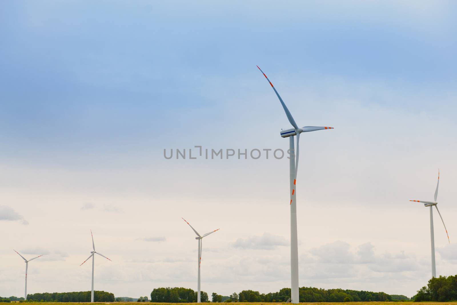 Windturbine. Eco power renewable energy production from wind. Windmill saves the earth's natural ingredients. Green ecology and pure electricity.