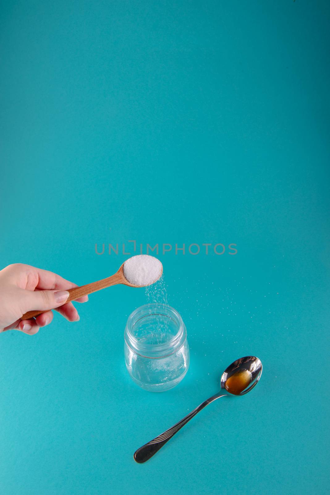 close up of honey jar on blue by Brejeq