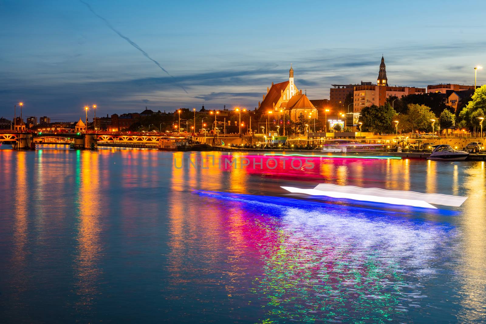 Szczecin. Night view from across the river to the illuminated hi by Brejeq