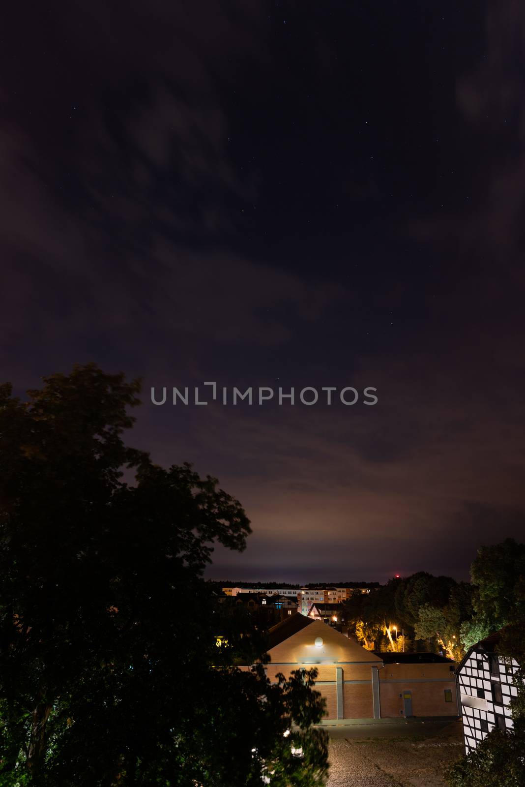 Szczecin. Night view from across the river to the illuminated hi by Brejeq