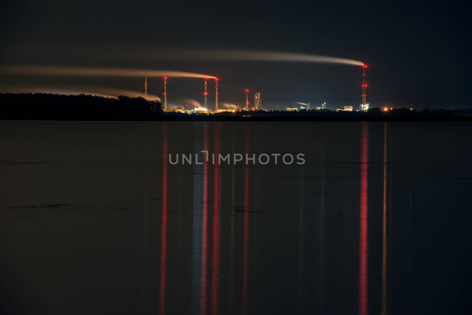Industrial park at night, Tall chimney with smoke. Police Poland by Brejeq
