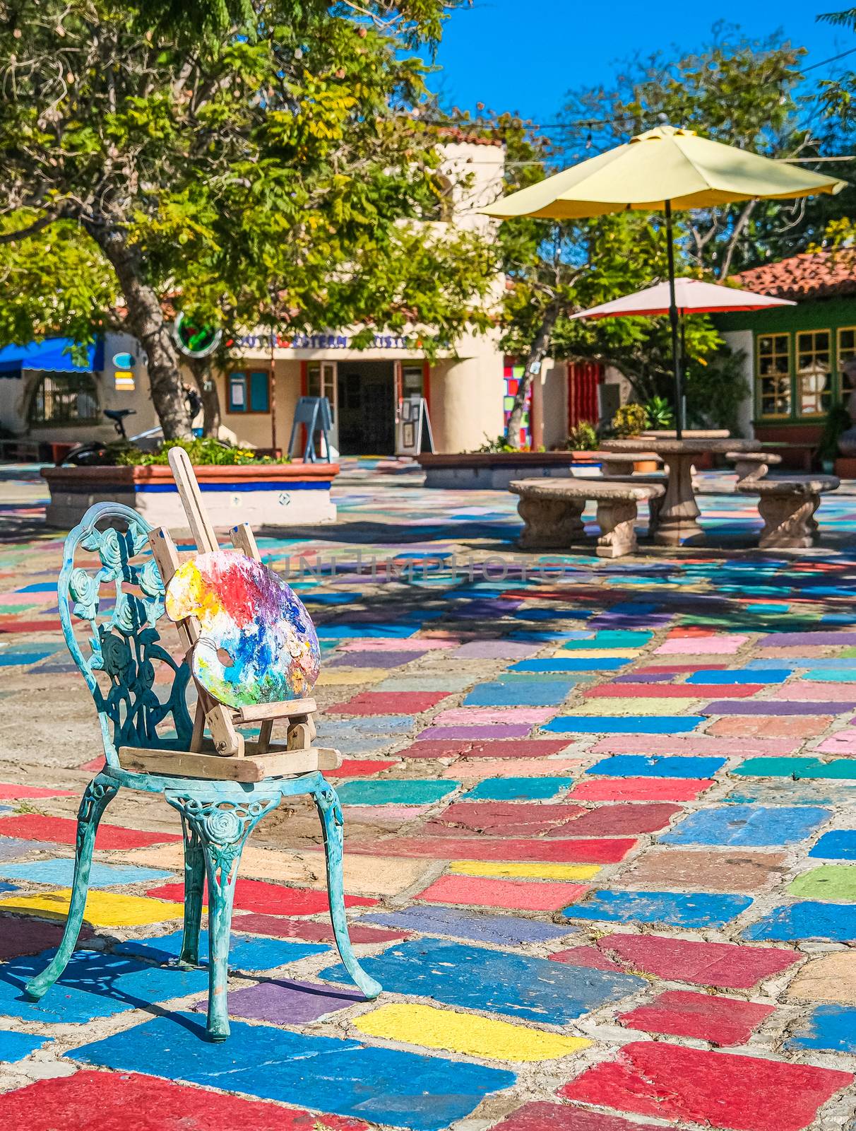 Artist Palette in Chair in Colorful Courtyard