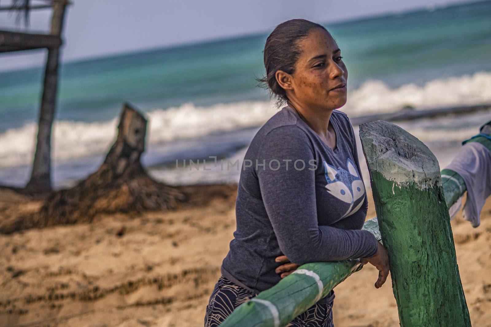 PLAYA LIMON, DOMINICAN REPUBLIC 28 DECEMBER 2019: Dominican poor woman on the beach