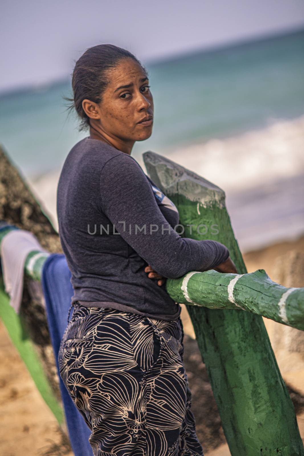 Dominican poor woman on the beach by pippocarlot