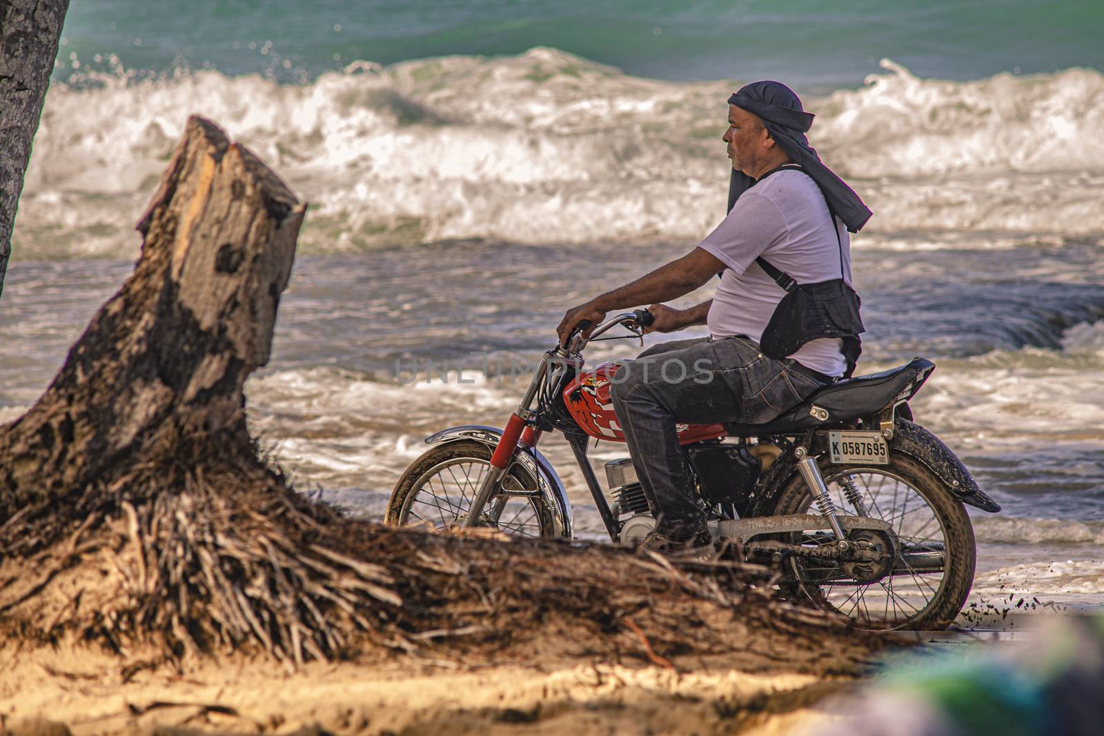 Biker on the Caribbean beach 2 by pippocarlot