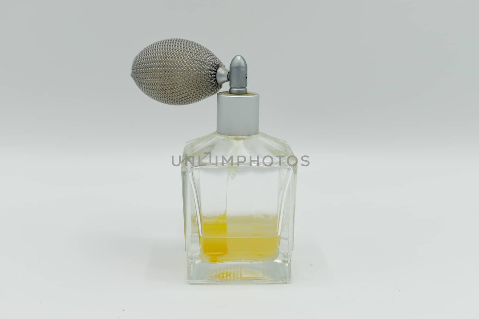 Perfume sprayer isolated on white background by benentaylor