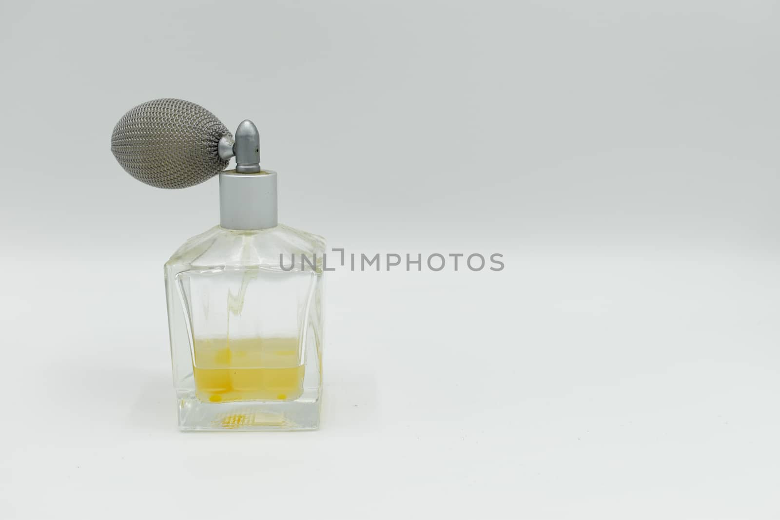 Perfume sprayer isolated on white background by benentaylor