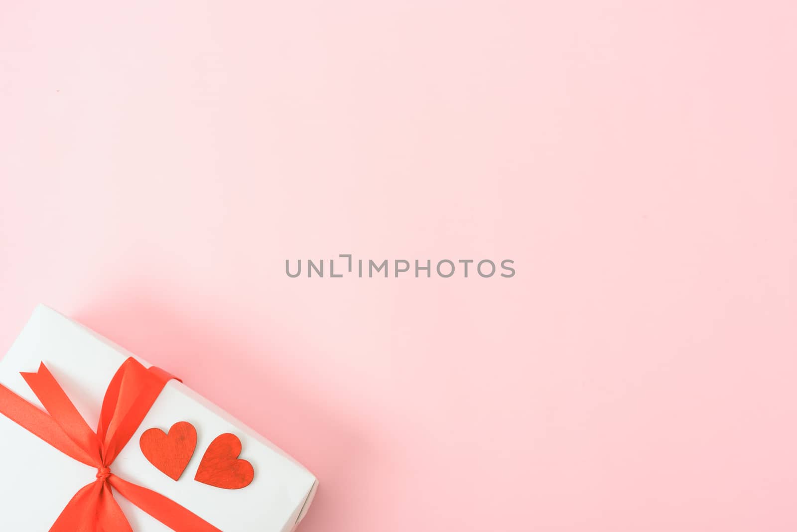 Valentine's Day Concept, Top view Flat lay, red heart and gift box on Pink background with copy space for your text