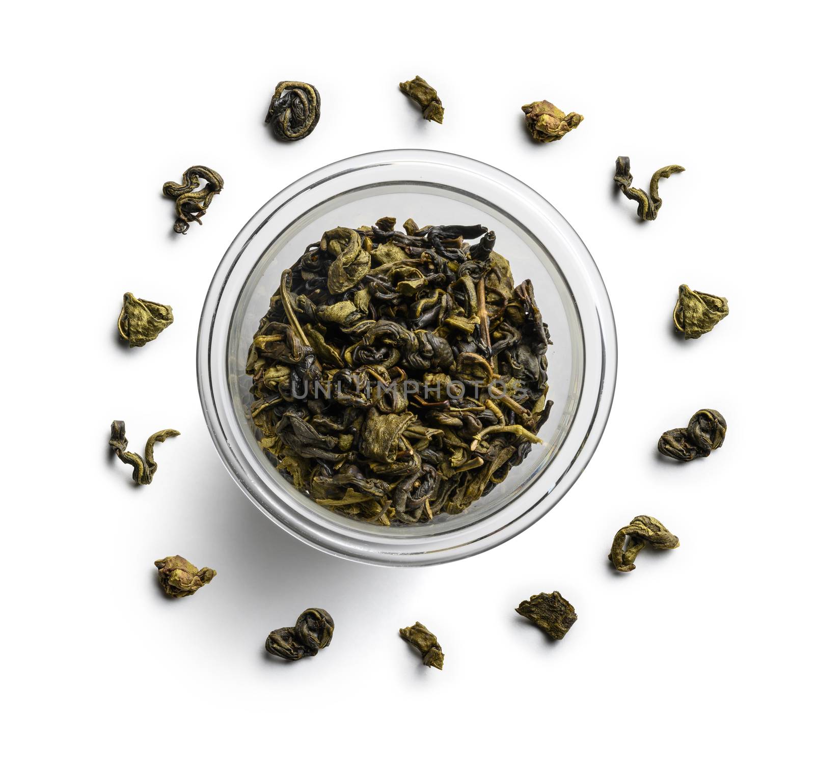 Green tea lies in a circle on a white background. The view from the top.