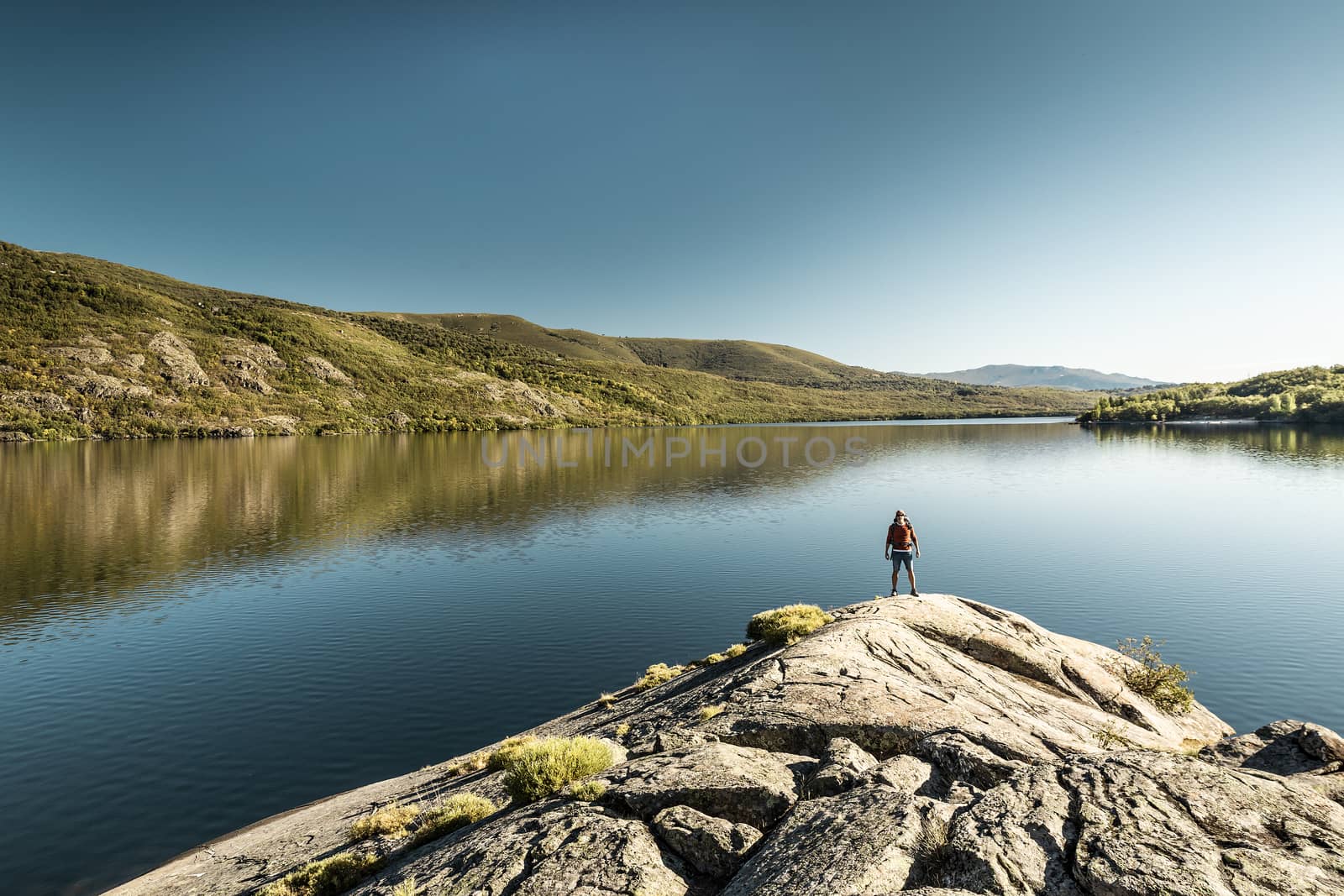 Rear view of a man near a beautiful lake 