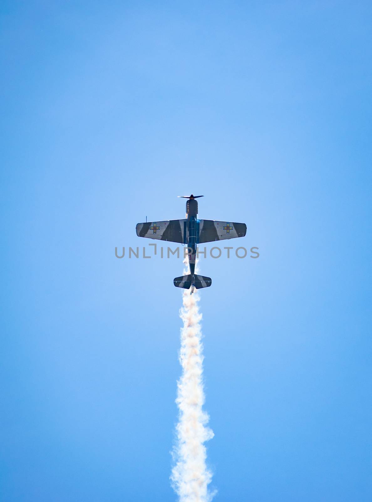 Bucharest/ Romania - AeroNautic Show - September 21, 2019: YAK 52TW Airplanes flying trough the sky by Luca-Mih