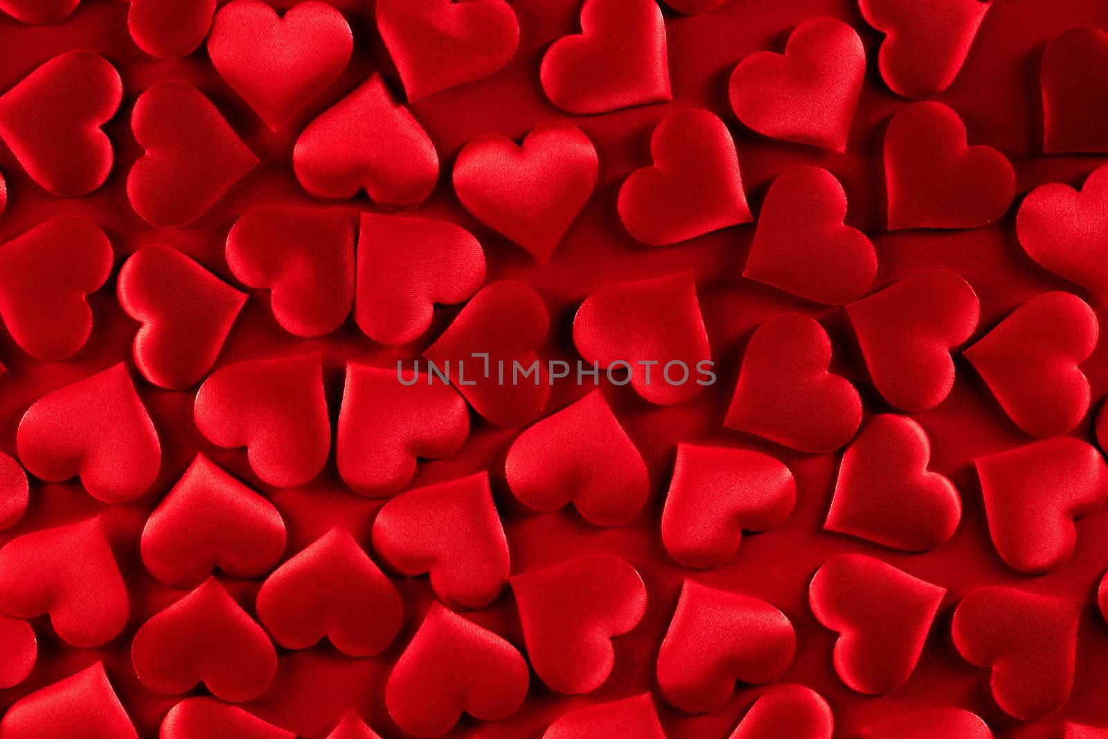 Valentine's day many red silk hearts background, love concept