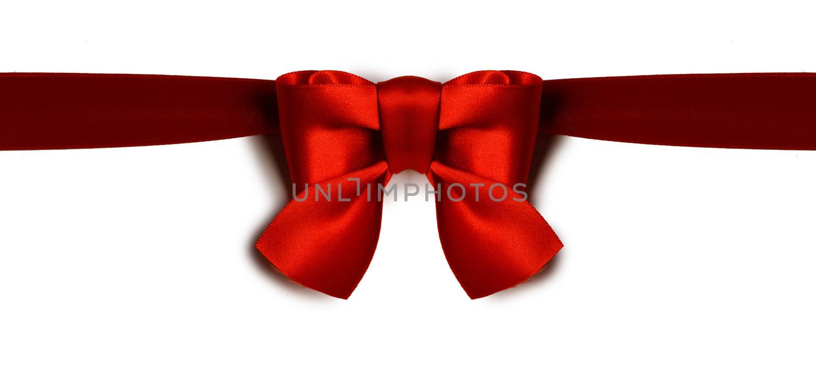 Red bow isolated on white by Yellowj