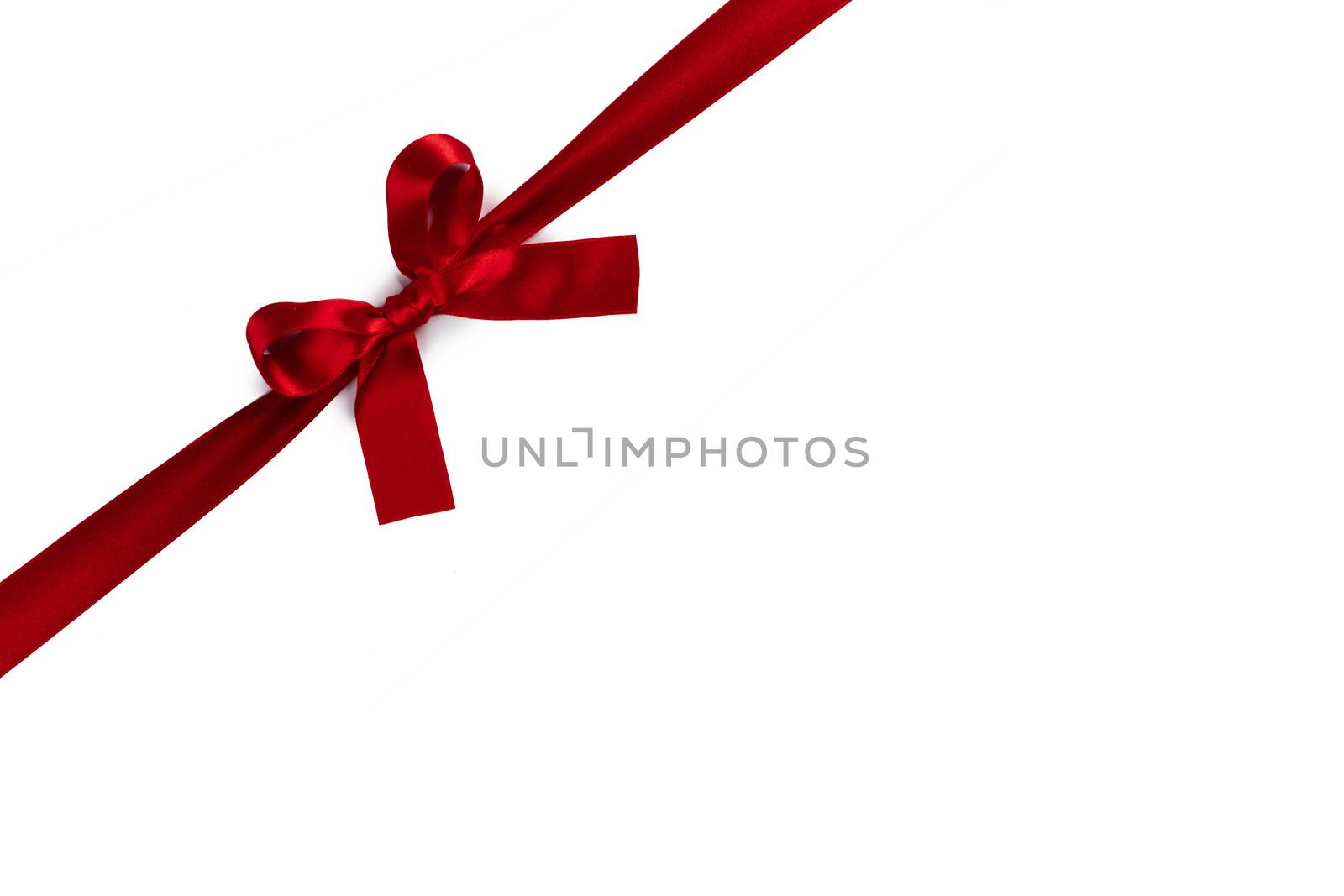 Red satin ribbon bow isolated on white background