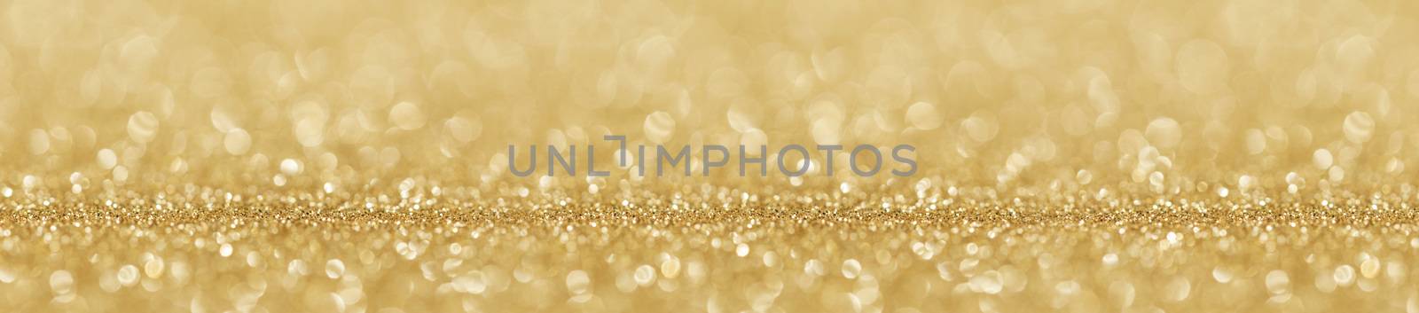 Shiny golden bokeh glitter lights abstract background, Christmas New Year party celebration concept