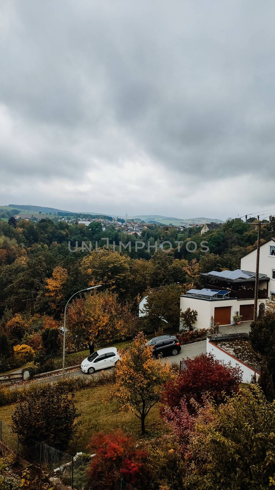 Beautiful countryside landscape in village. Germany - vertical photo, autumn landscape