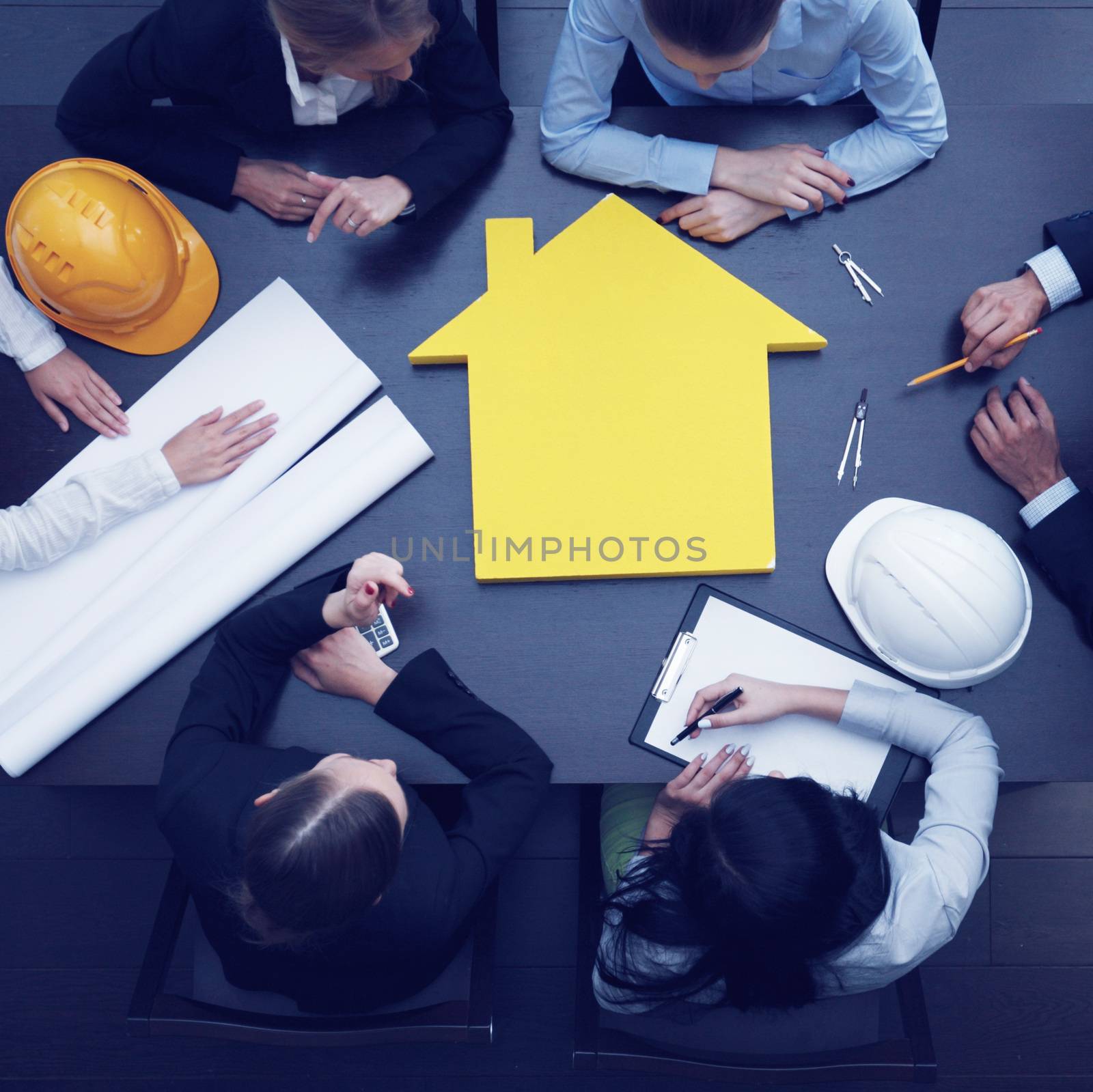 Top view of people around table in construction business meeting