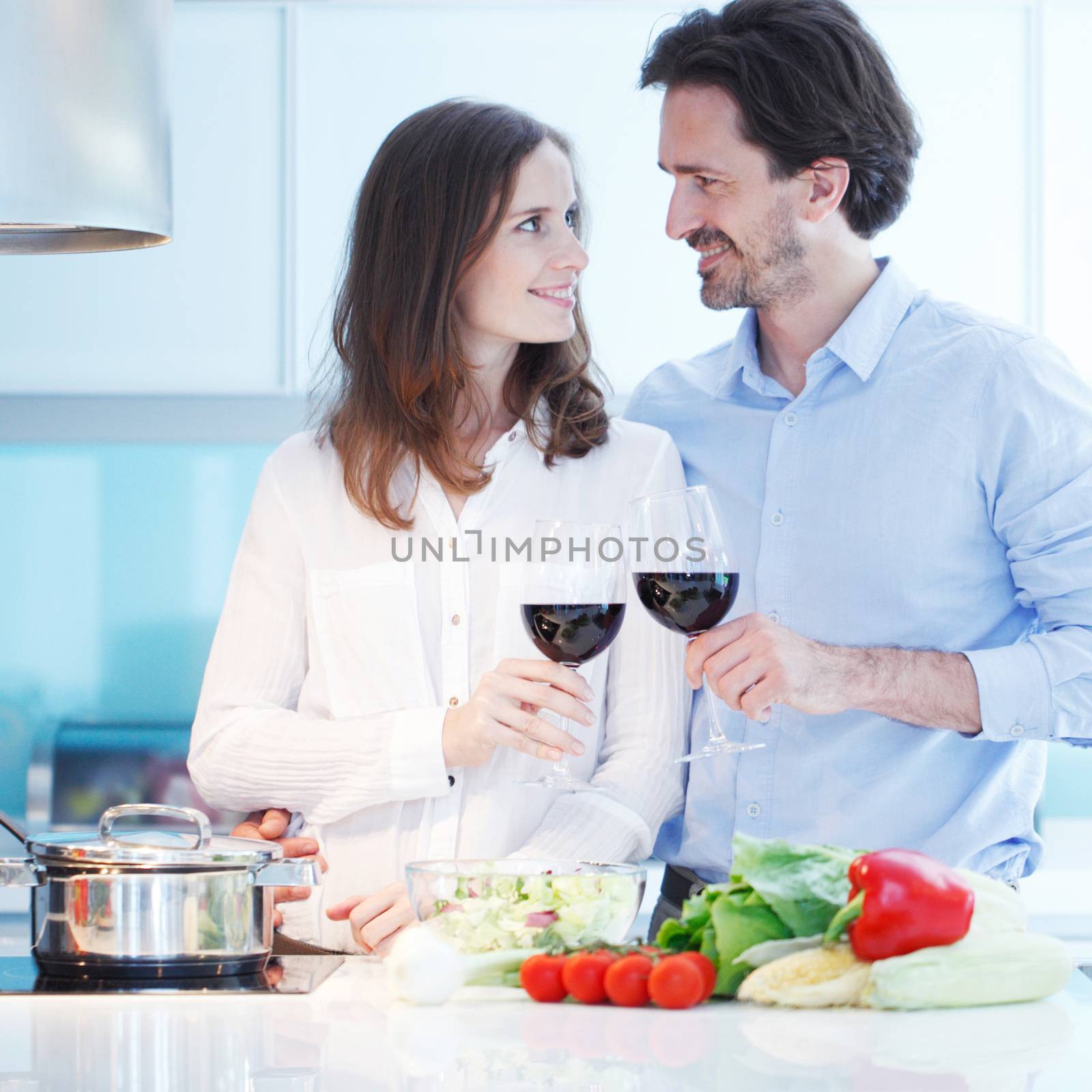 Couple cooking dinner by ALotOfPeople