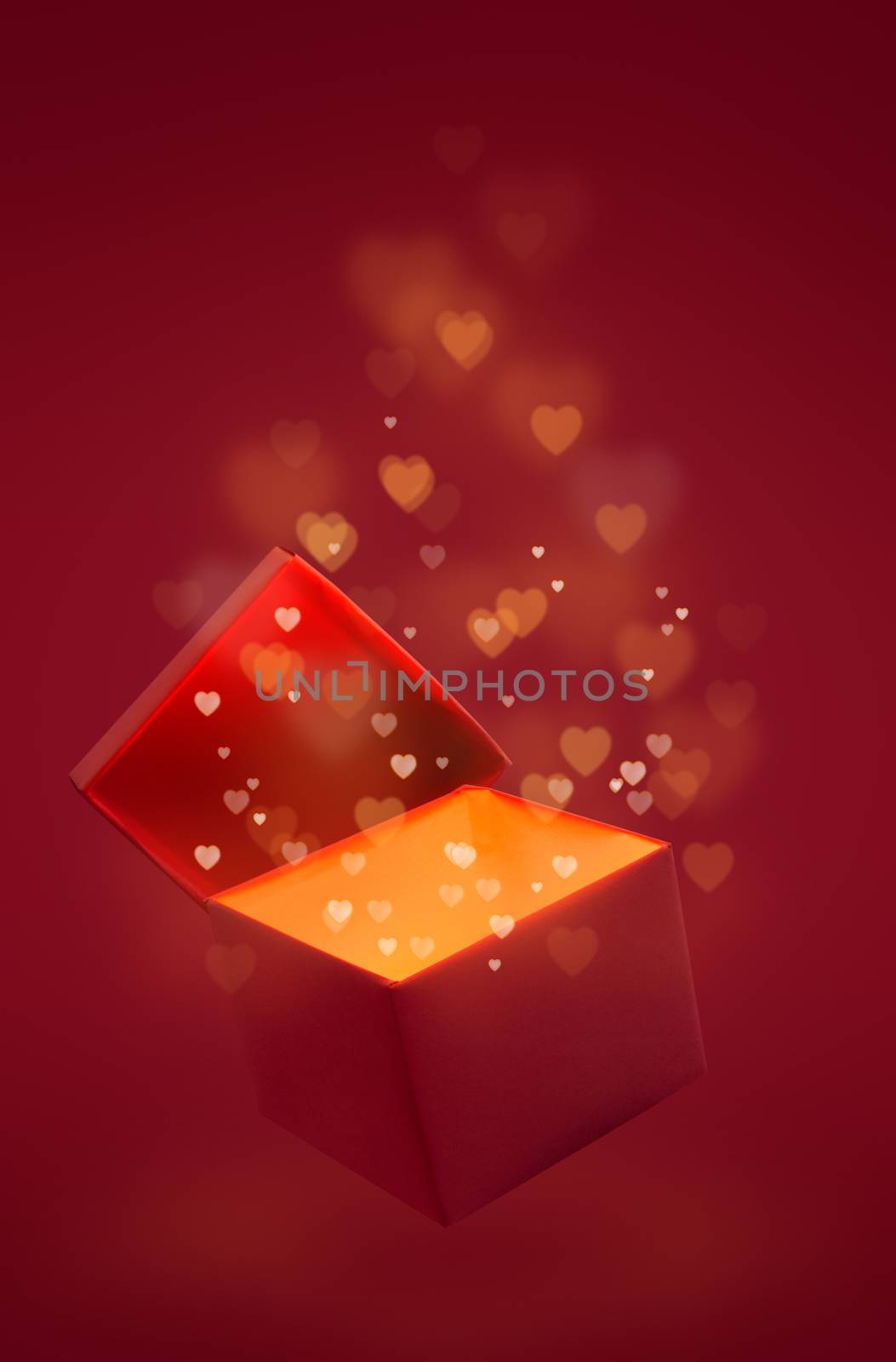 Magic box with love gift for Valentines day, pink red glowing with light from inside with bokeh hearts