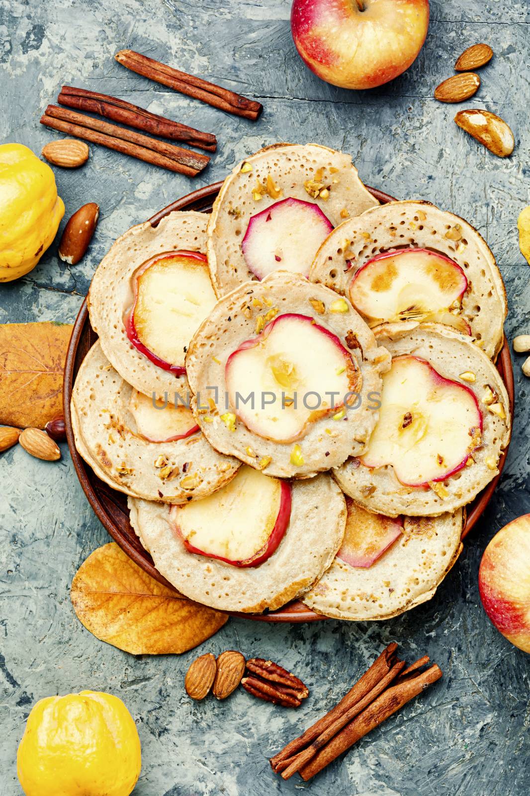 Homemade fried pancakes stuffed with apples.Autumn food