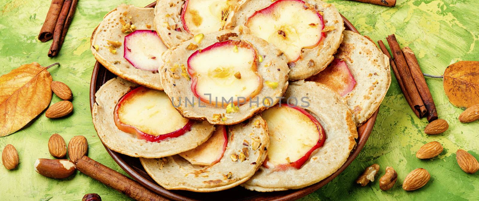 Fried pancakes filled with ripe autumn apples.Autumn dessert.