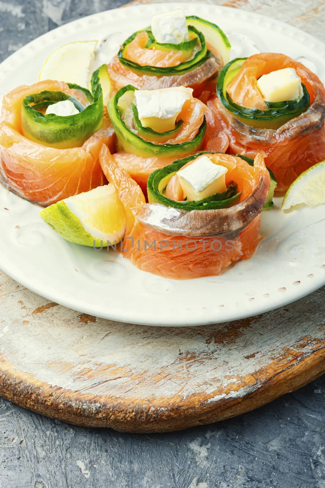 Salmon roll with cheese,cucumber and lime.Rolls of red fish fillet